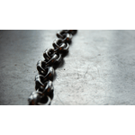 Alloy chain laying on concrete