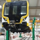 Image of Train Being Lifted By Crane System