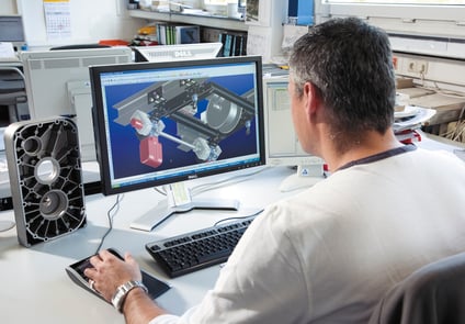 Image of Man working on Computer with MarketingPortal plus Application