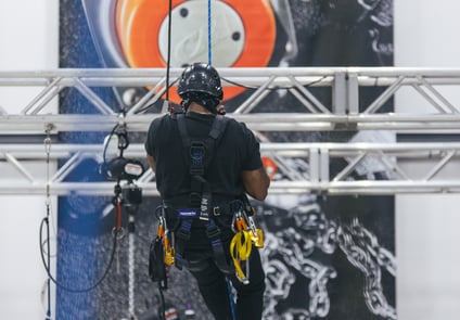 Image of man holding onto rope