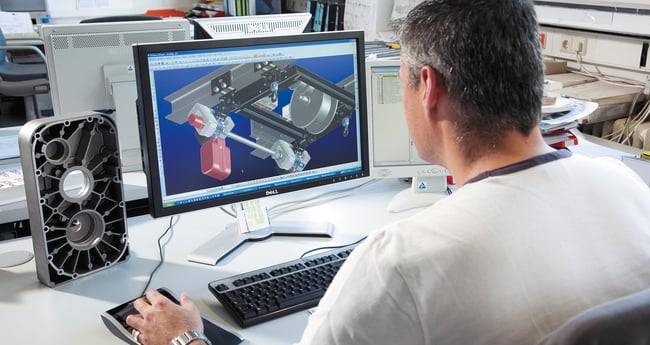 Image of Man working on Computer with MarketingPortal plus Application