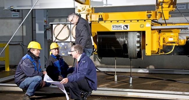 Image of Four people Working on STAHL Crane Systems