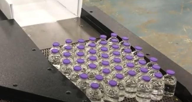 Image of Conveyor moving pharmaceutical product down line