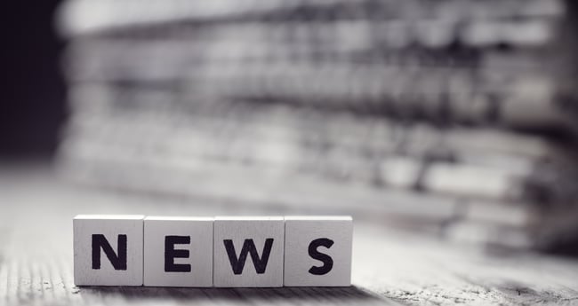 Black and White Image of Letter Blocks spelling out NEWS