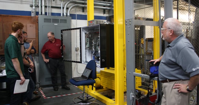 Image of a Man teaching a group of people in the DC Drive Training Course