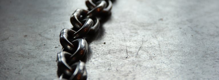 Alloy chain laying on concrete