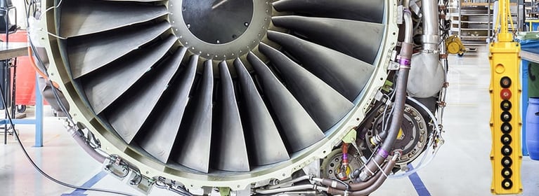 Image showing a jet engine with a control pendant being repaired.