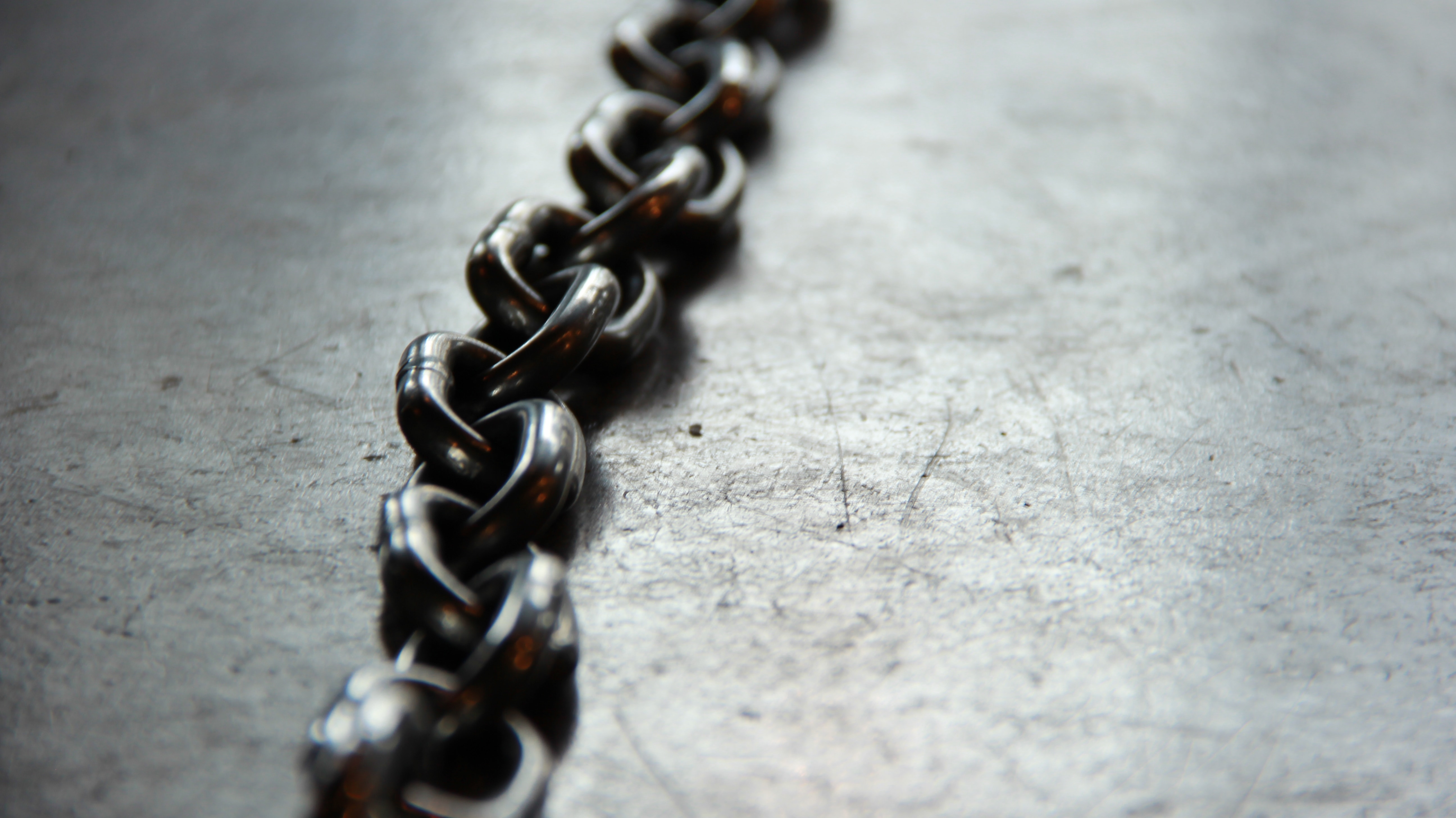 Alloy chain laying on concrete